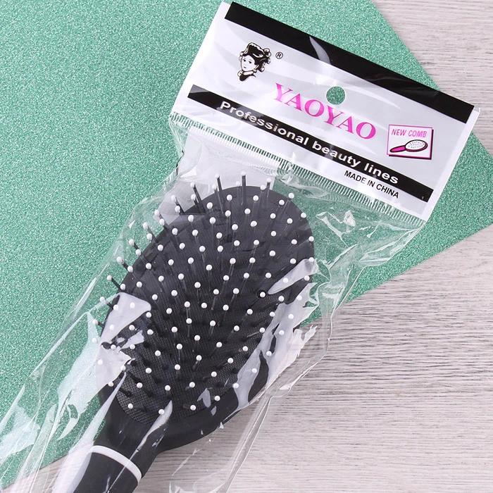 Расческа массажная овальная пластиковая черная Расческа массажная овальная пластиковая черная